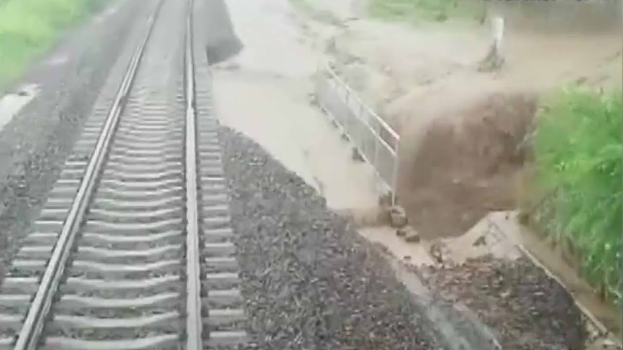 Heavy rain washes away railroad bed in northeast China