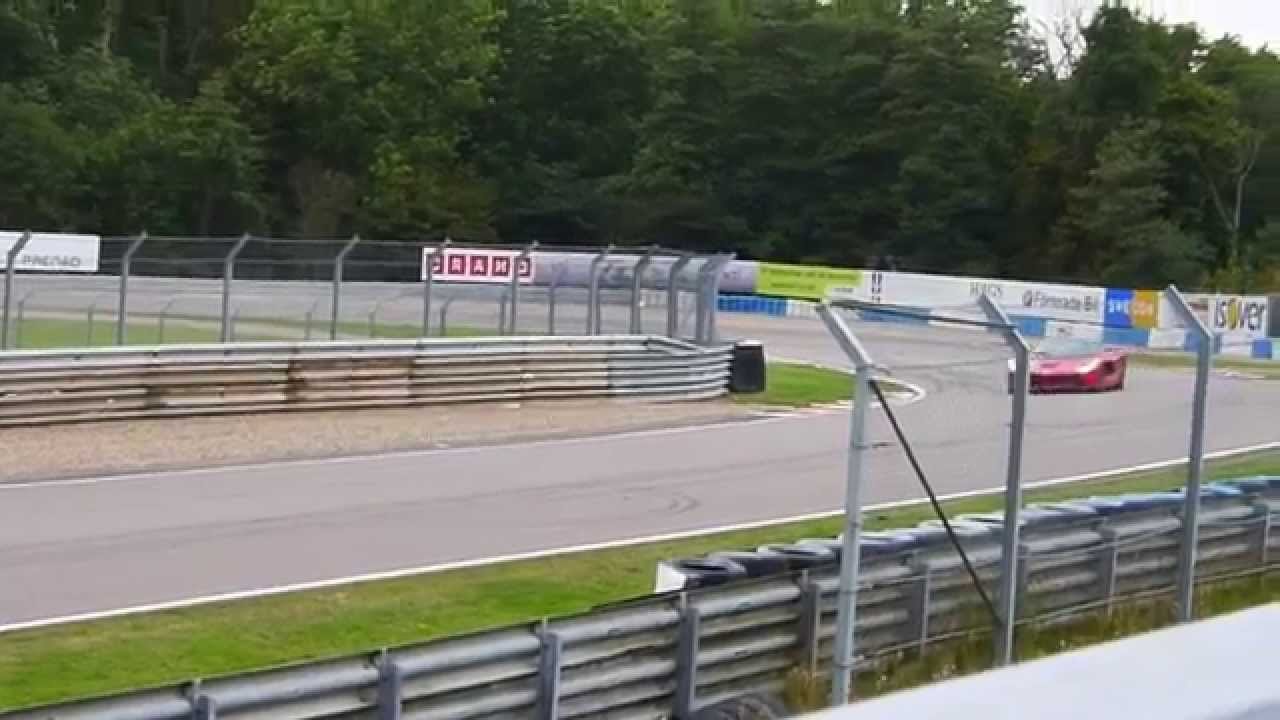 Ferrari LaFerrari and McLaren P1 at a racetrack - HD