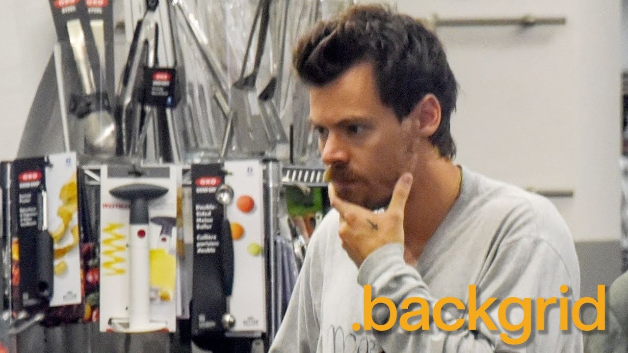 Harry Styles looks relaxed during his Italian trip, shopping with a friend in Rome