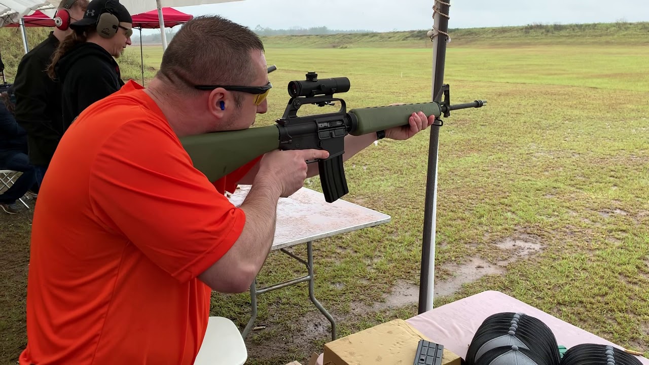 Brownell’s M-16 clone a with 4X Retro Optic