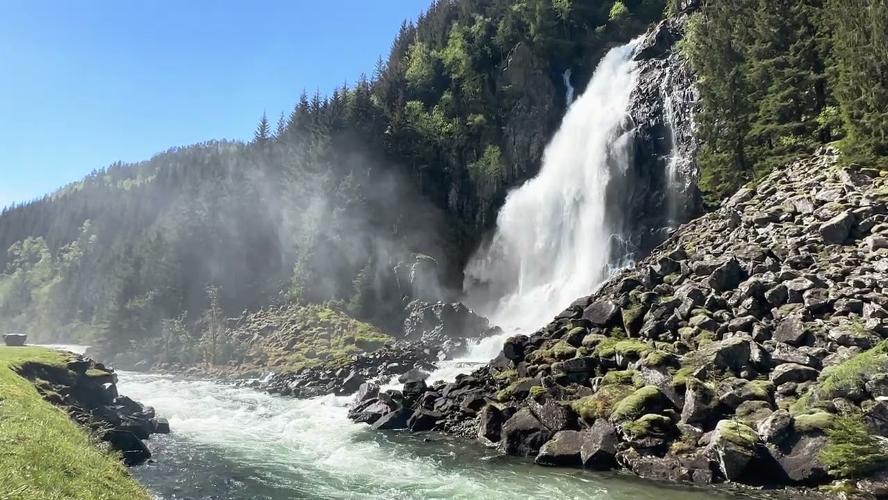 Waterfall into a river flowing by | Norway | 7 Hr