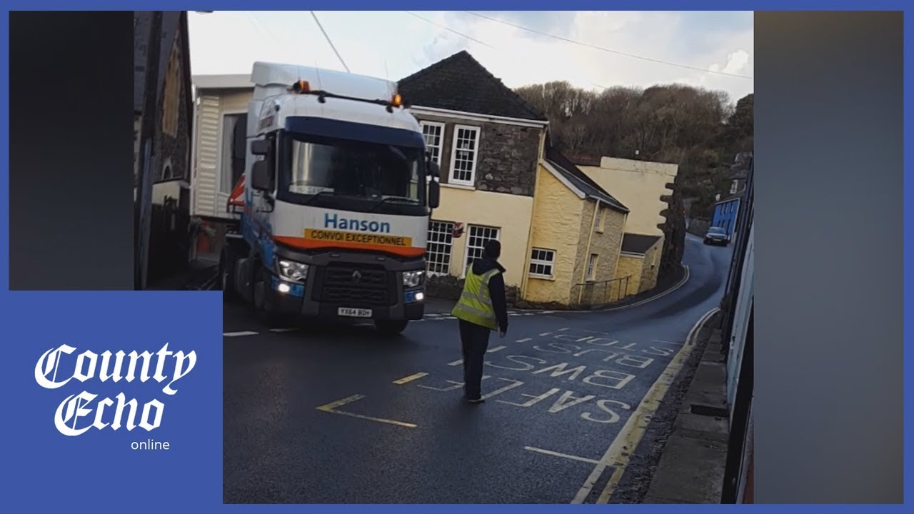 Wide load navigates Fishguard Lower Town's narrow streets