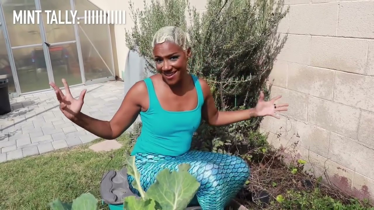 Tiffany Haddish Mermaid in the Garden pulling Mint