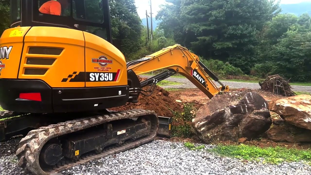 Sany SY35U Mini Excavator and Massey Tractor Working the Land
