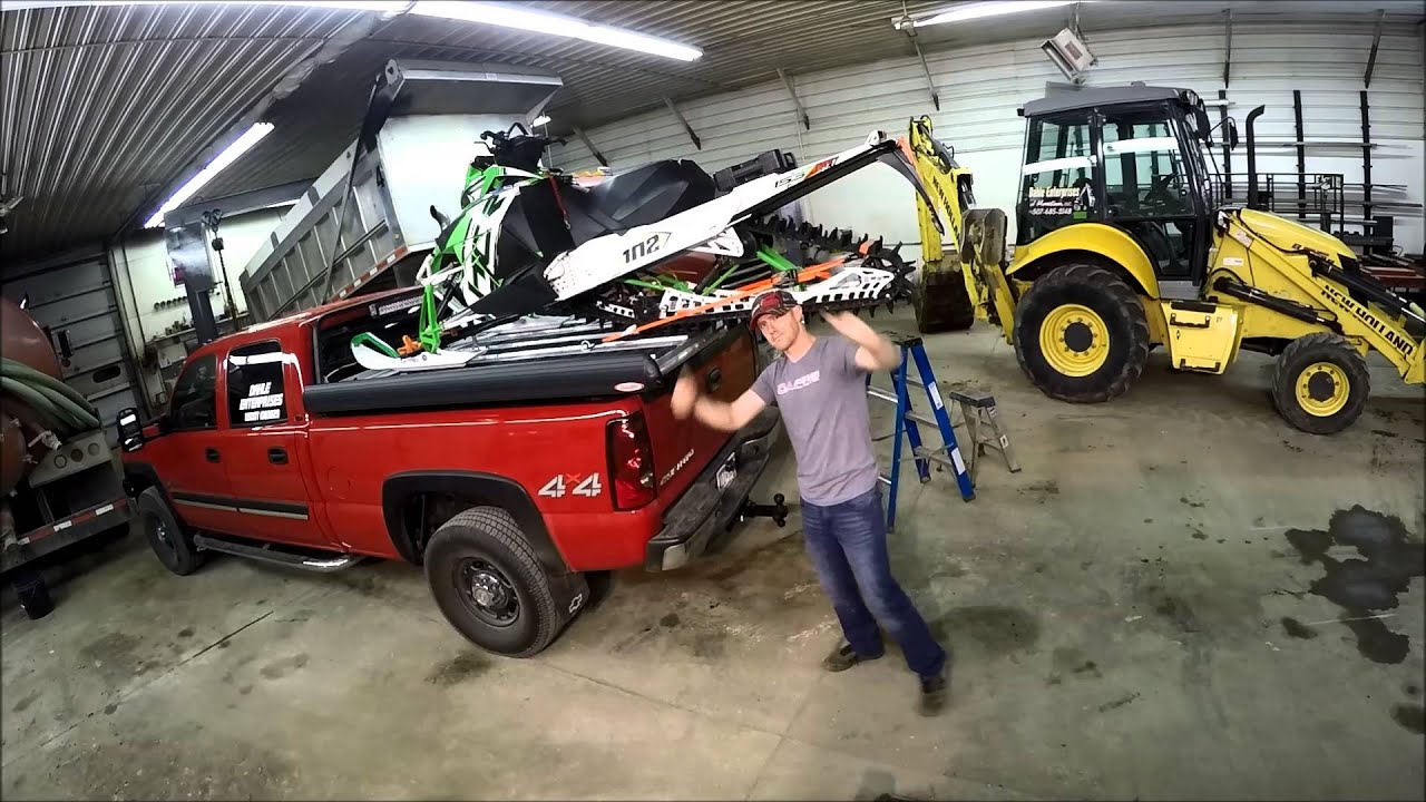 TRUCKBOSS - Loading a snowmobile on the sled-deck