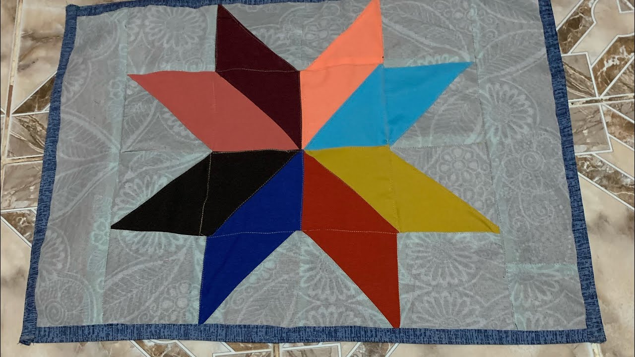 TAPETE DE RETALHOS COM TRIÂNGULOS FORMANDO ESTRELA  / PATCH CARPET WITH STAR FORMING TRIANGLES