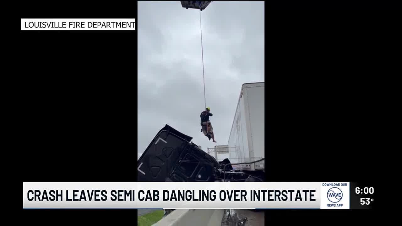 Driver rescued after crash leaves semi-truck cab dangling over overpass near Kennedy Bridge