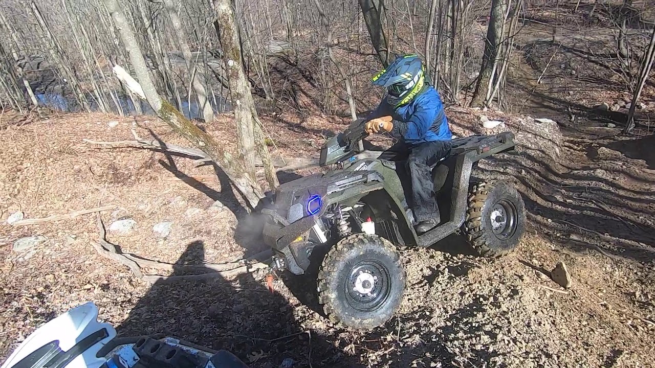 Polaris Sportsmans and Yamaha Grizzlys riding Lost Trails ATV park in Dunmore PA.