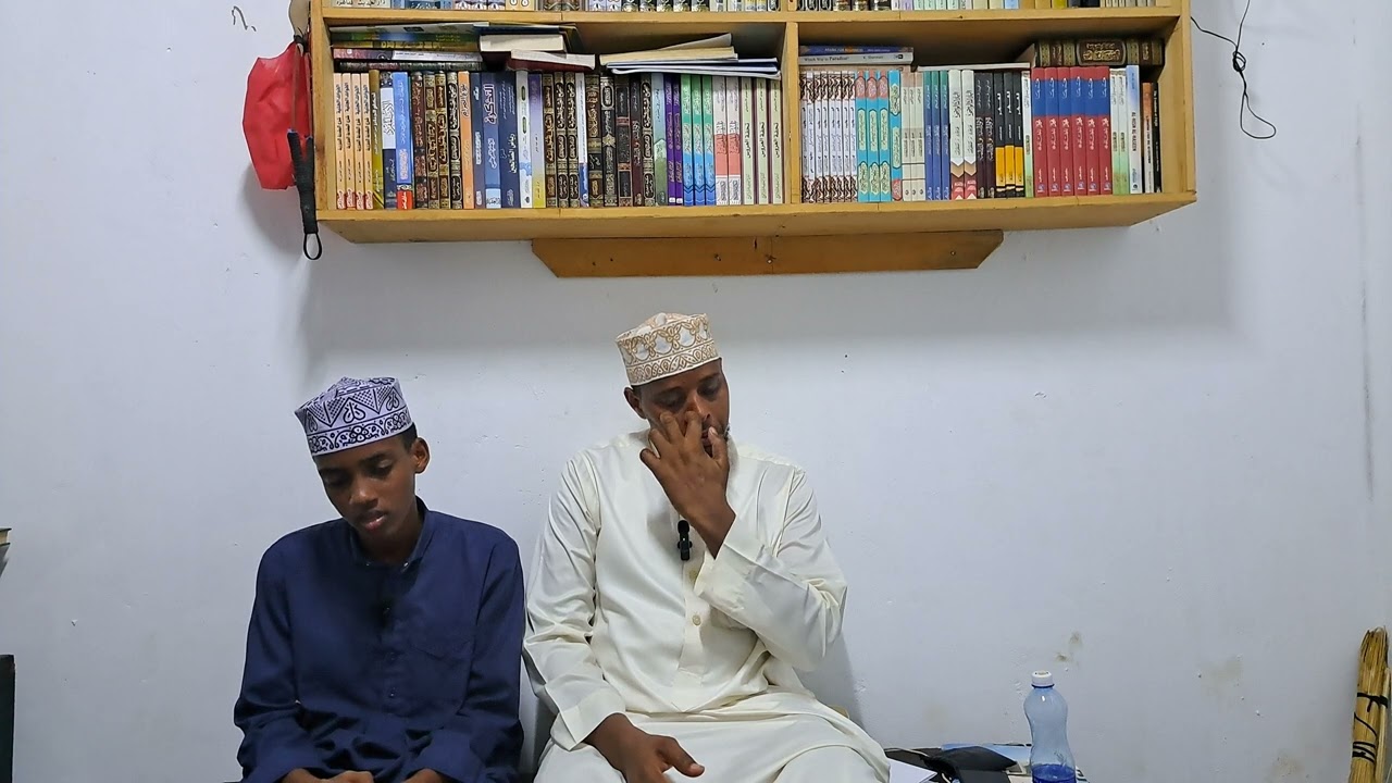 Quran recitation as Sheikh corrects his students mistake