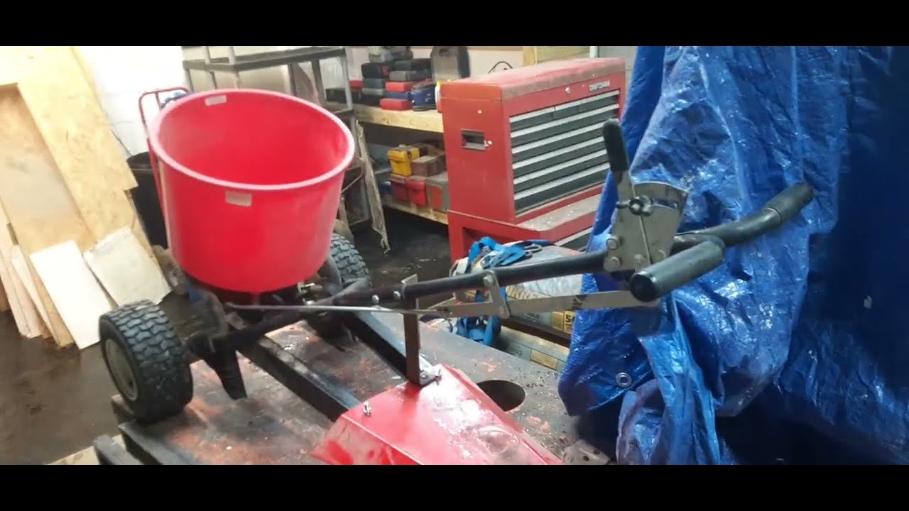How to make a tow behind from a push type spreader the easy way !