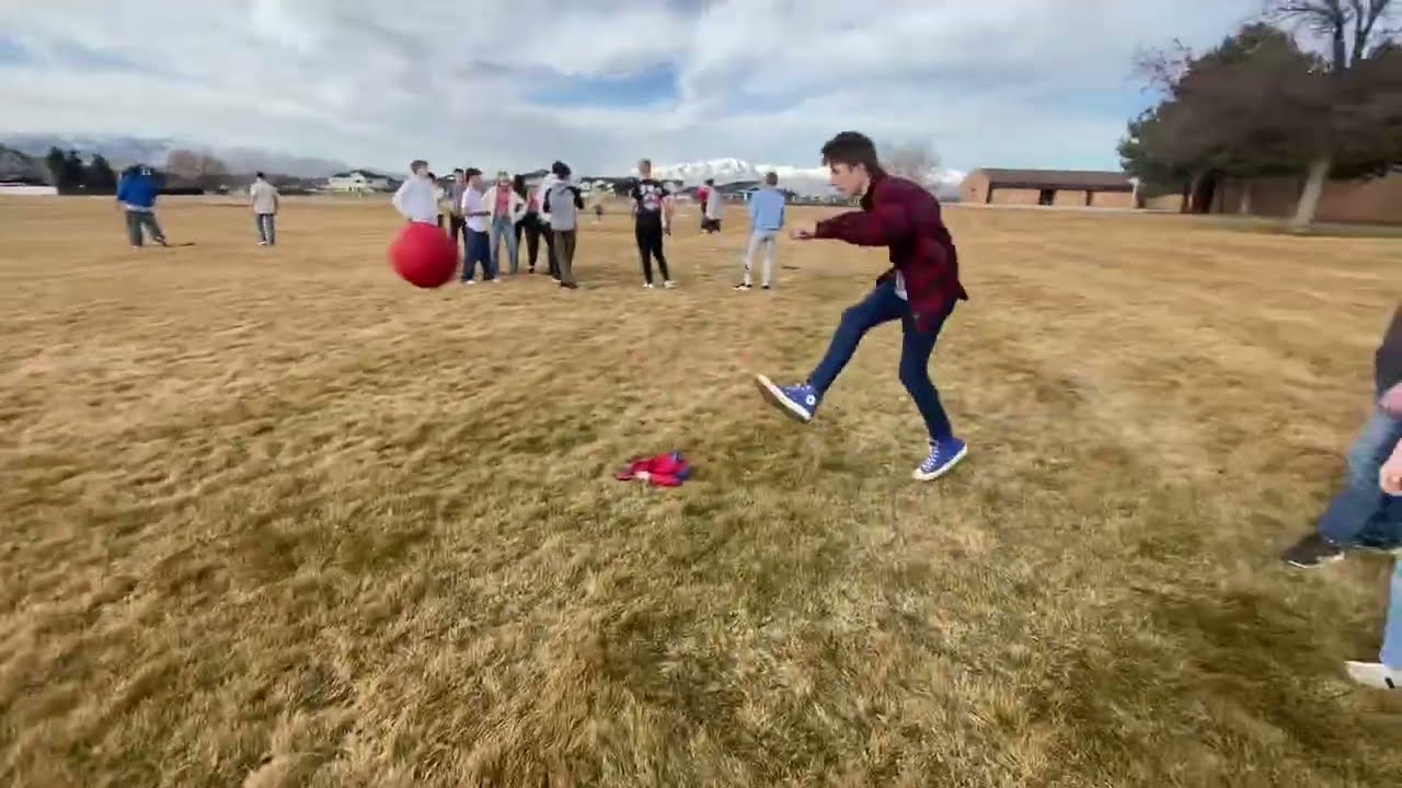 Playing kickball at my school ￼