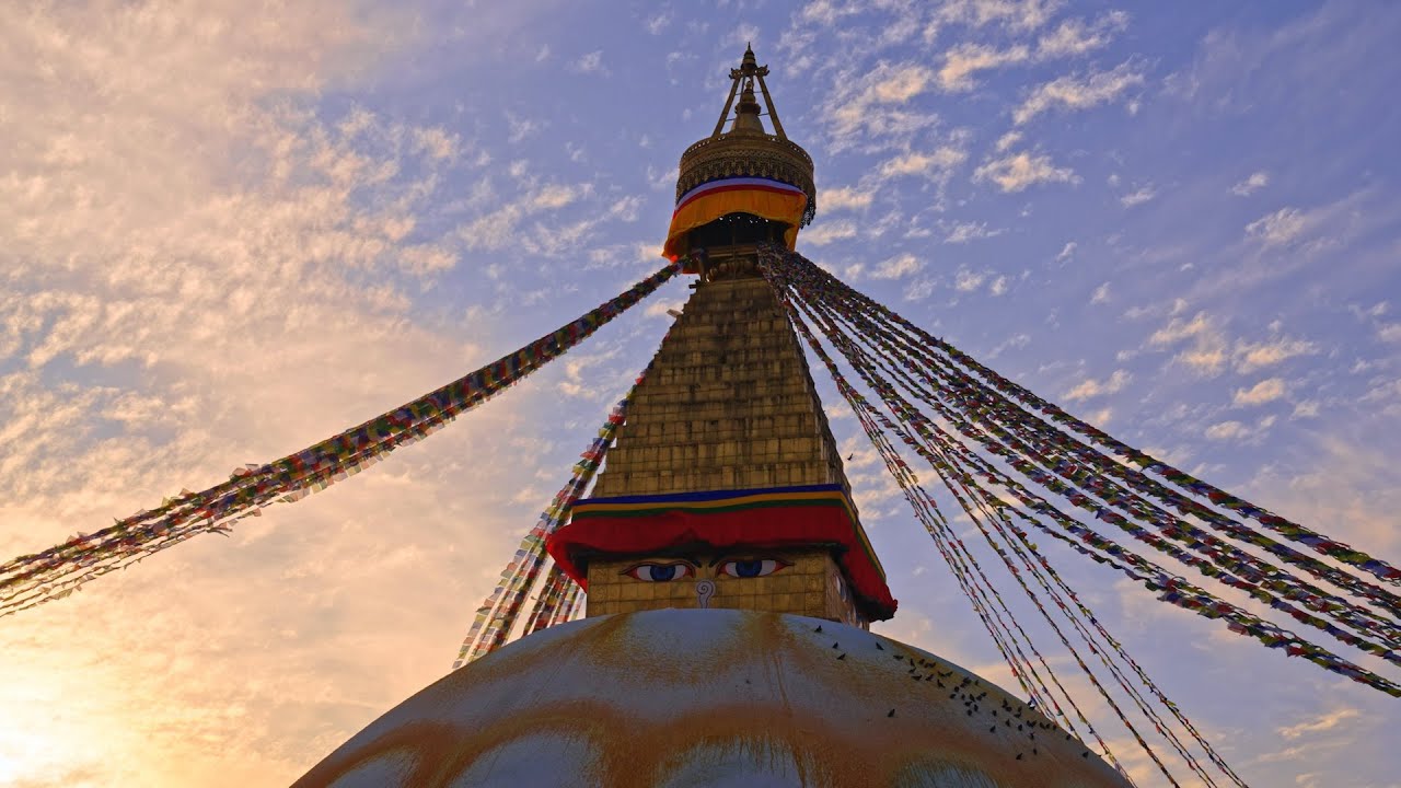 Parallax tracking of Boudhanath stupa during a golden hour sunset in Kathmandu, Nepal
