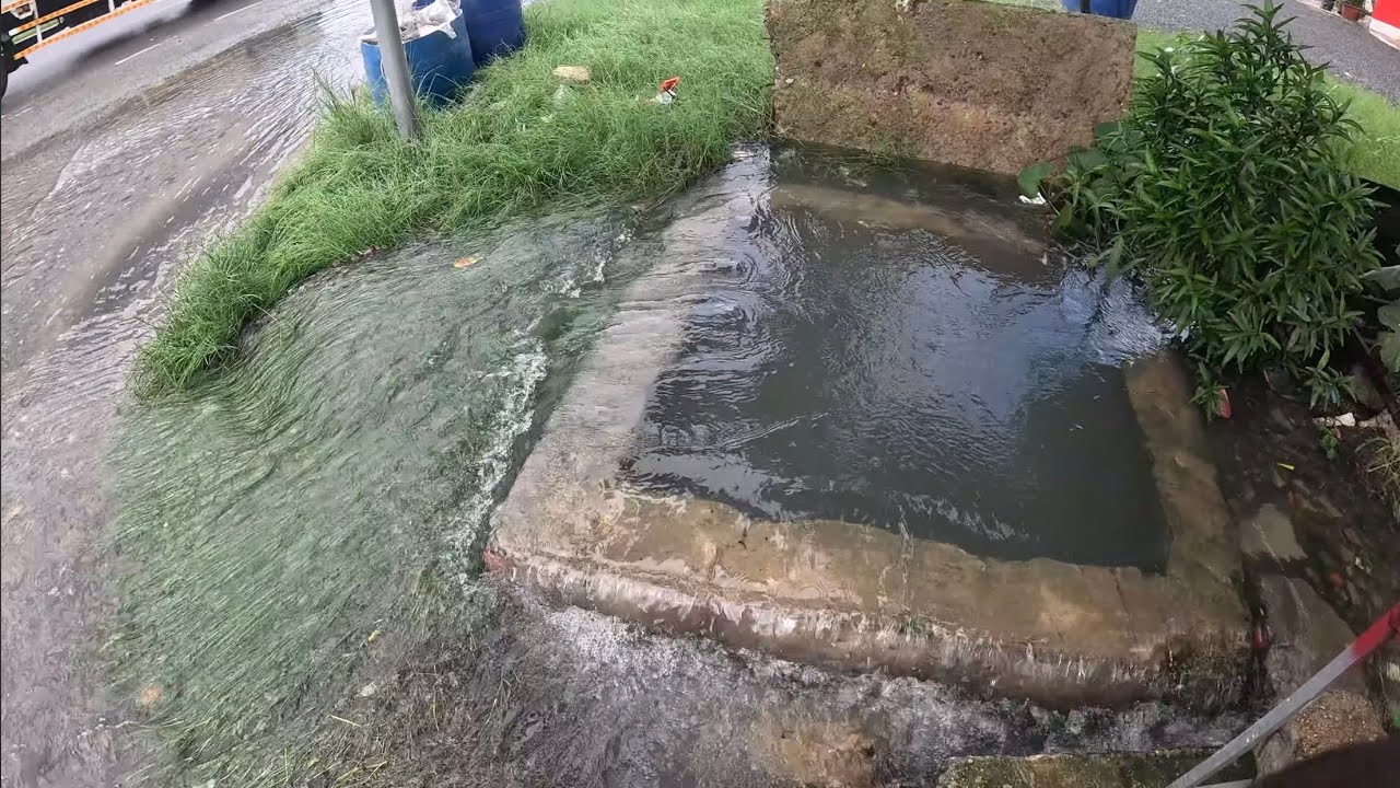 Hard work to Remove Garbage Unclog Drain After Rain Storm Flooding on the Street