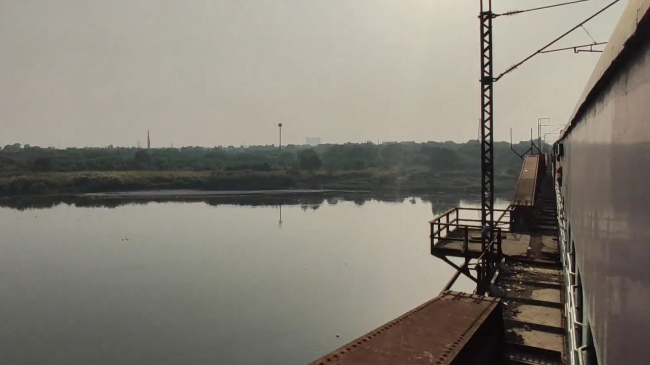 Train Crossing Over The Iconic Old Iron Yamuna Bridge of Delhi
