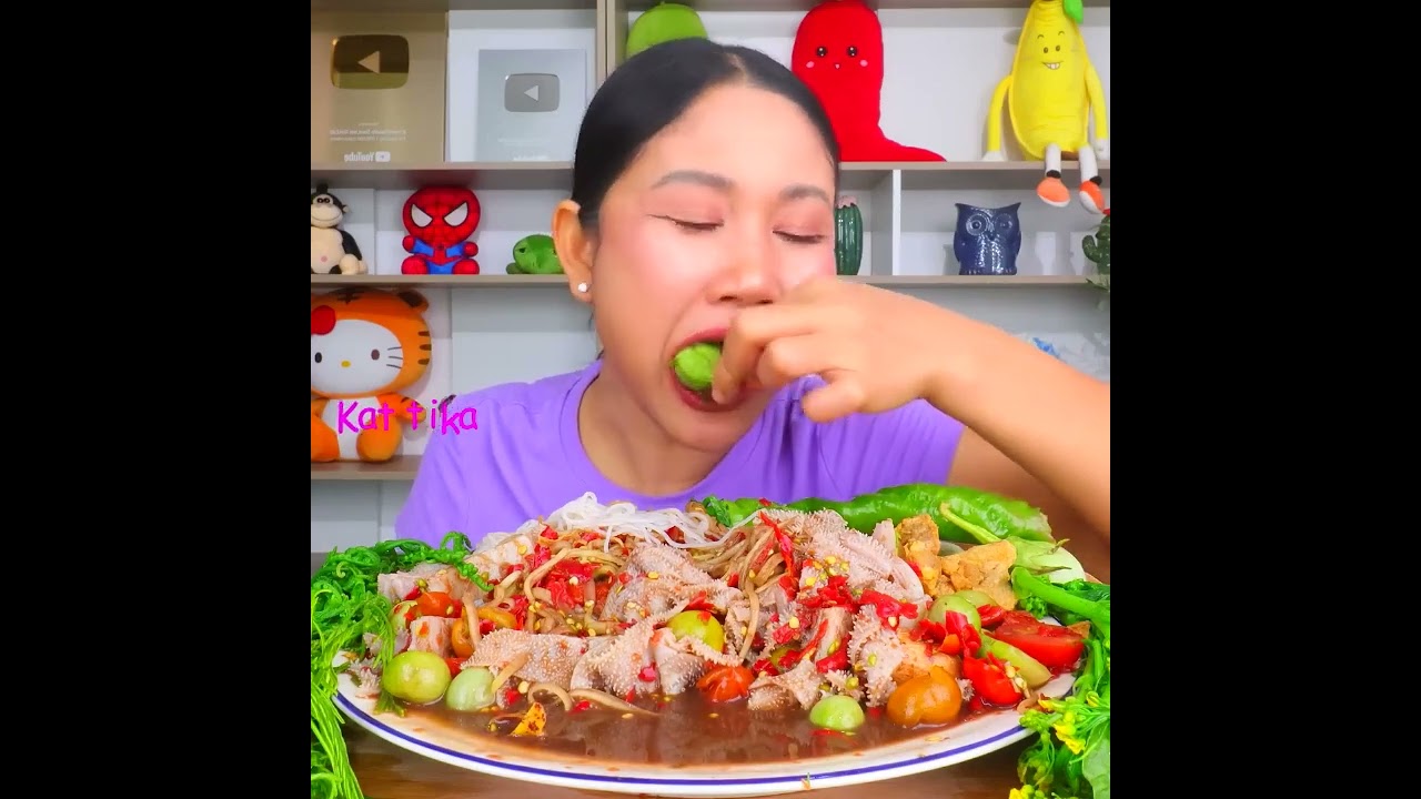 Eating spicy papaya salad with thirty petals of a herb, soft and chewy rice noodles, acacia leaves,