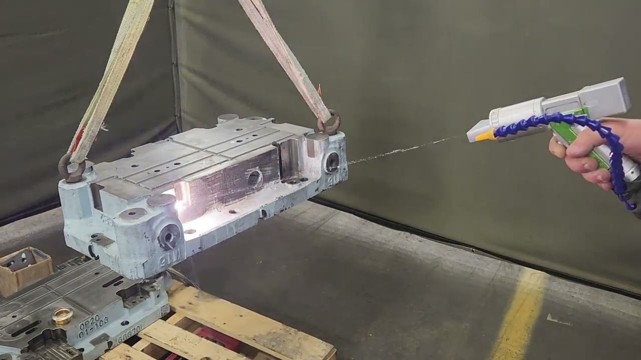 BesCutter 1500-Watt Laser Cleaning Solution for Paint and Grease Removal on an Industrial Machine