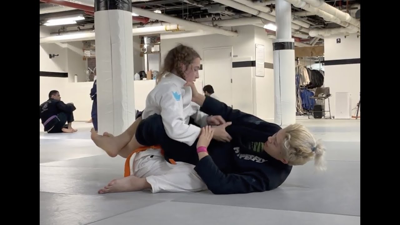 BJJ Black Belt Margot Ciccarelli rolling with BJJ Orange Belt Faith Burgess