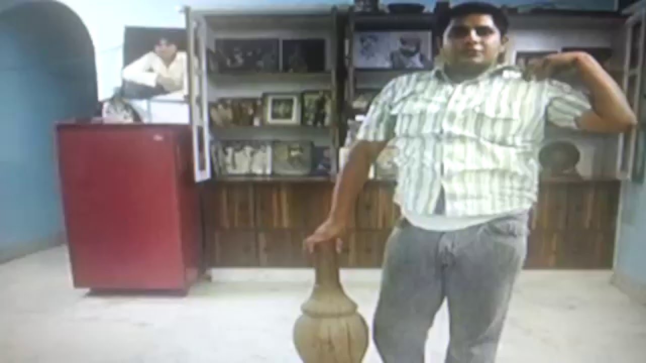 Akhara guru son explains proper technique for gada , mace and club mace