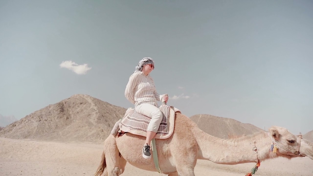 Women Riding on Camel In desert
