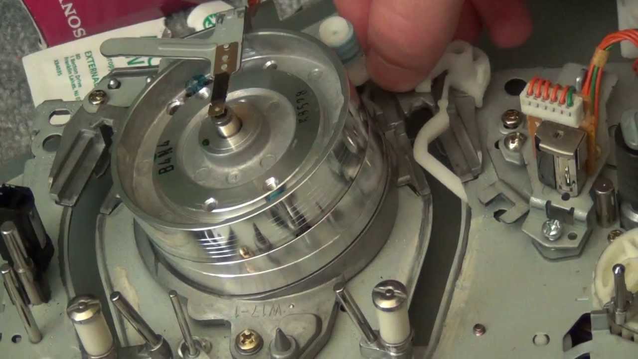 How to clean the tape transport in a VCR.