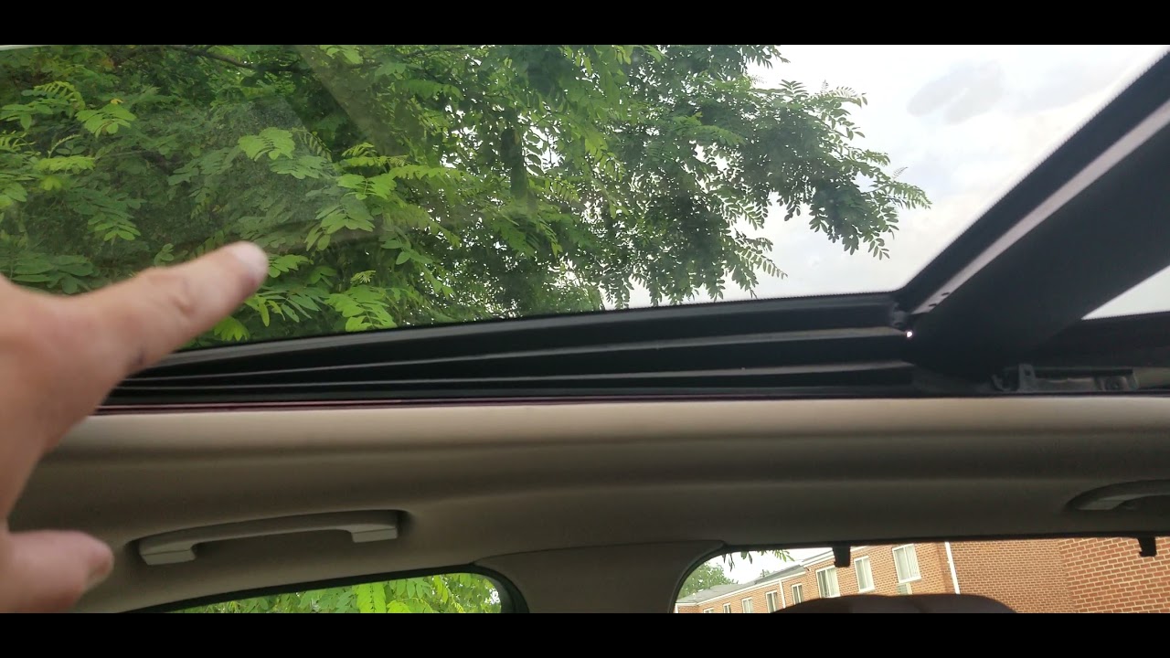 BMW x5 roof problem. roof partially stuck.