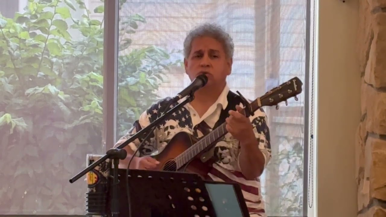 Tom Lovato performs a mini concert for his mother and the residents at the Evergreen Gardens.