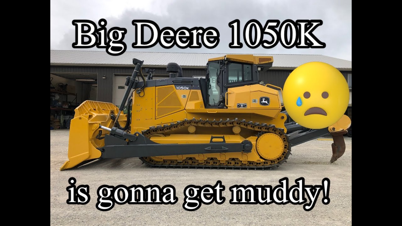 John Deere 1050K dozer pushing dirt and ripping rock along with 850J