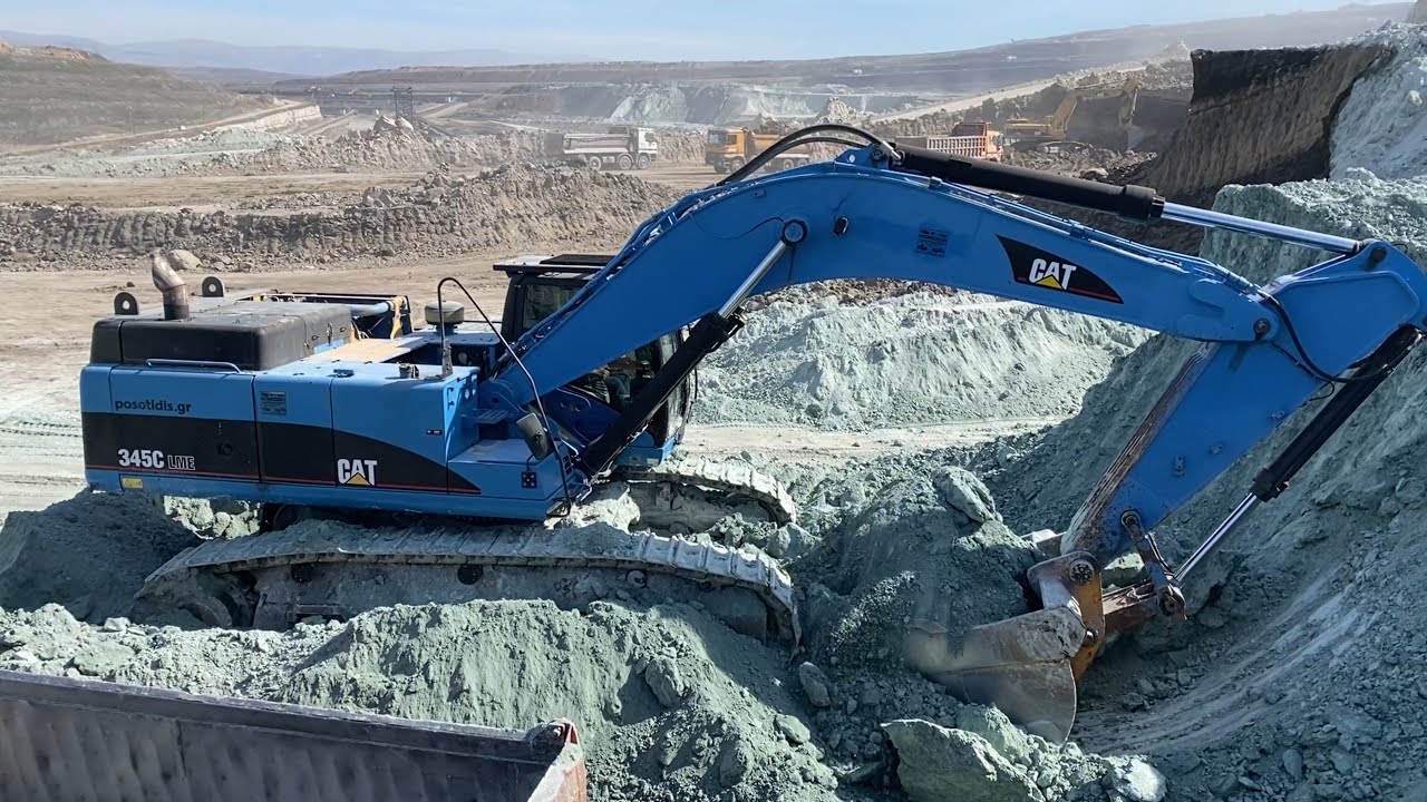 Caterpillar 345C Excavator Loading Trucks