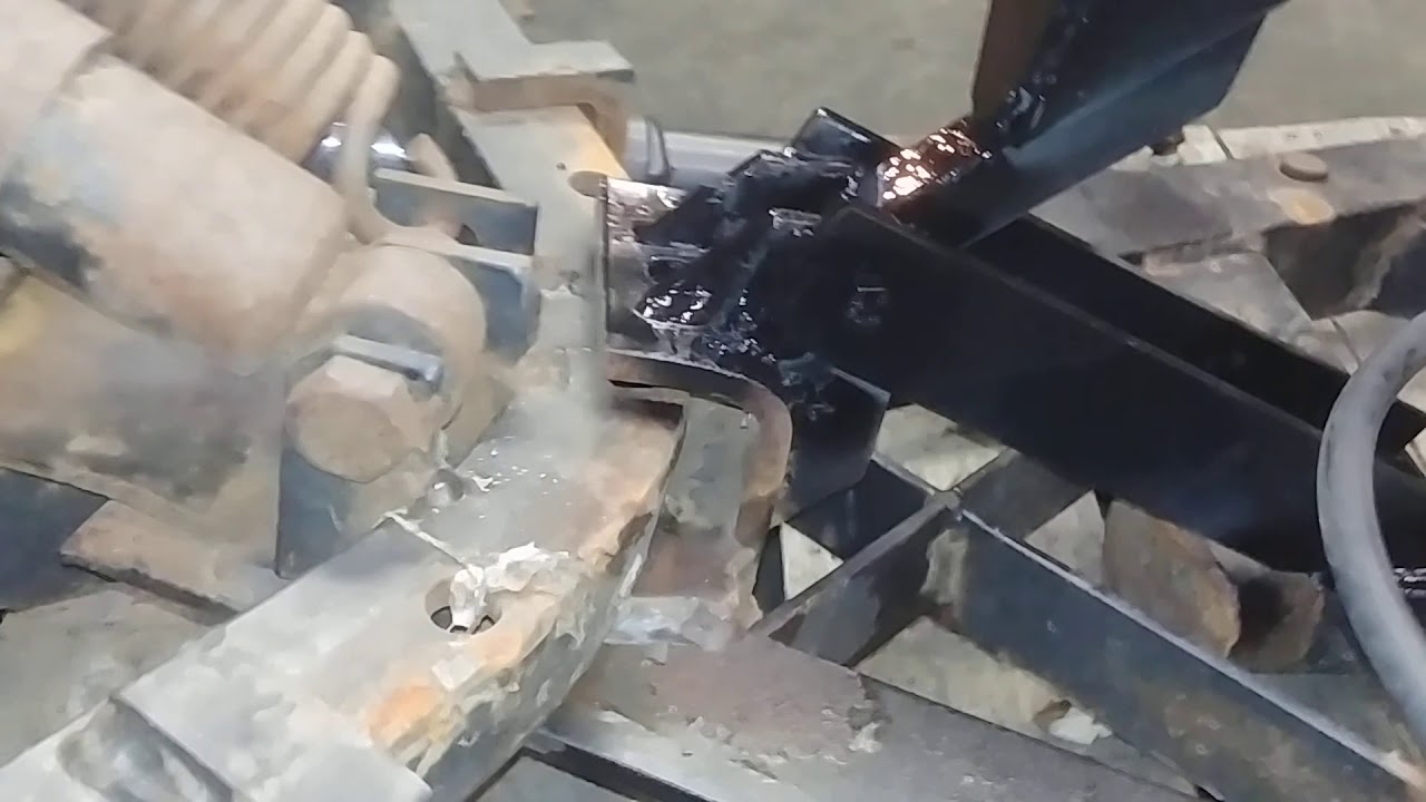 Minnesota Implement, truck plow conversion for using a Western Uni-mount plow on a skid loader.