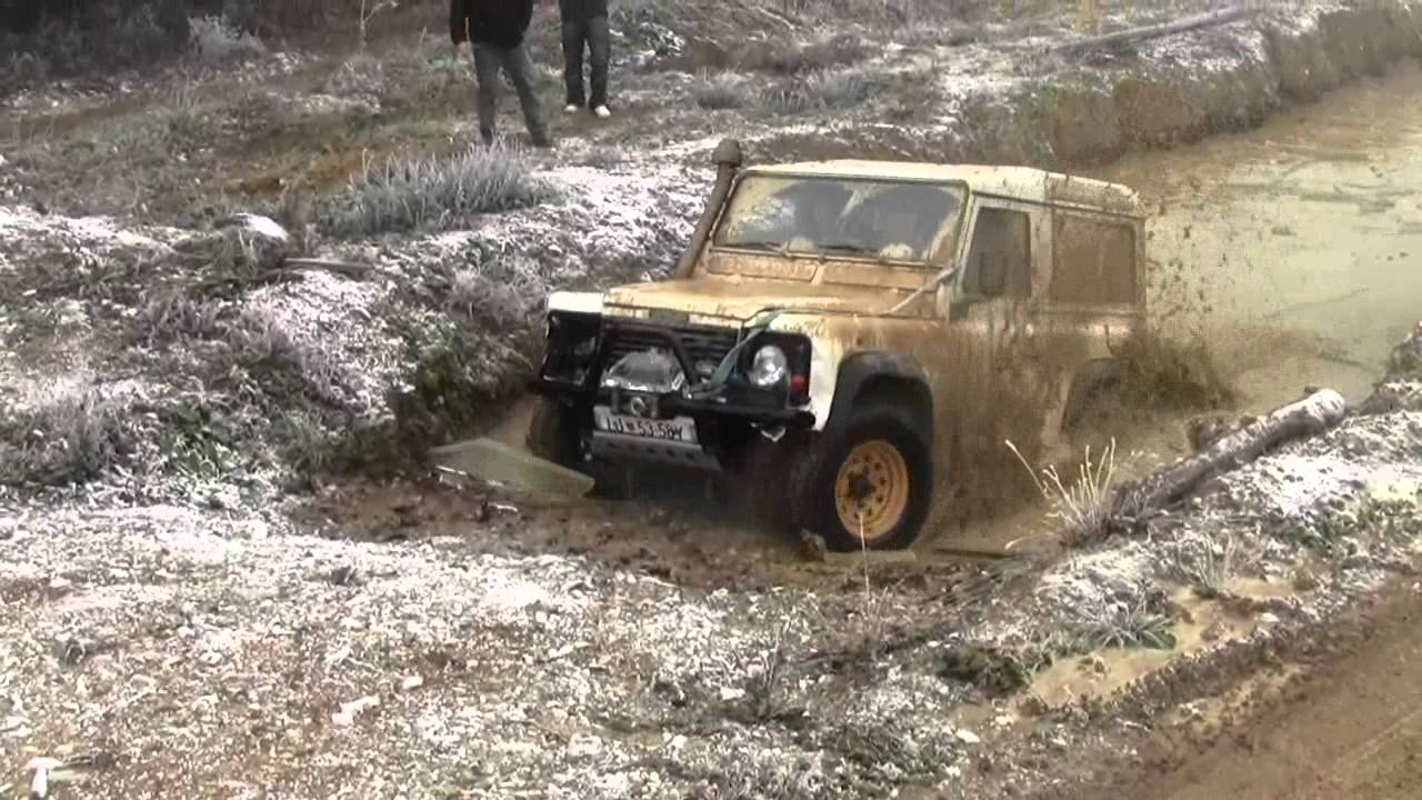 Land Rover Defender in the water hole