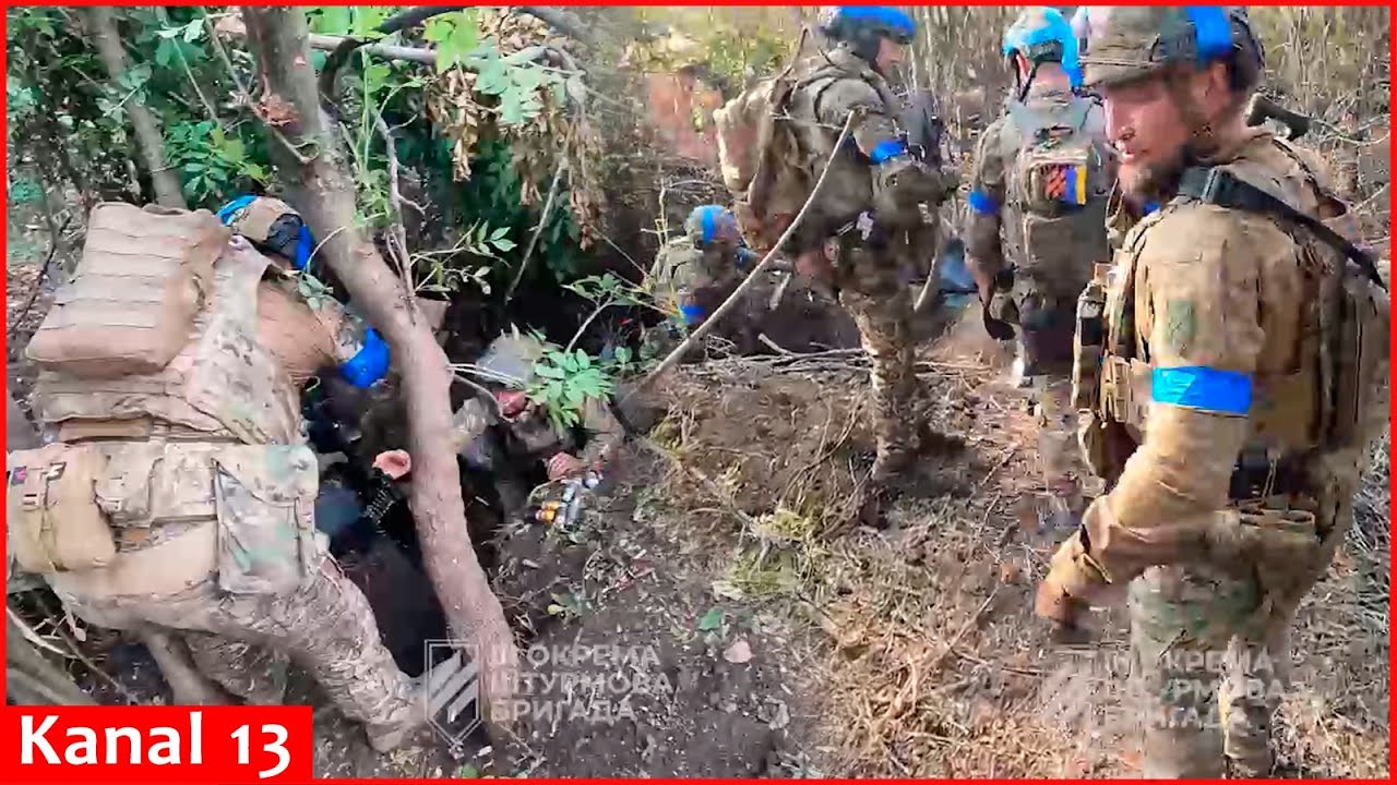 Ukrainian soldiers show captured Russian positions - 
