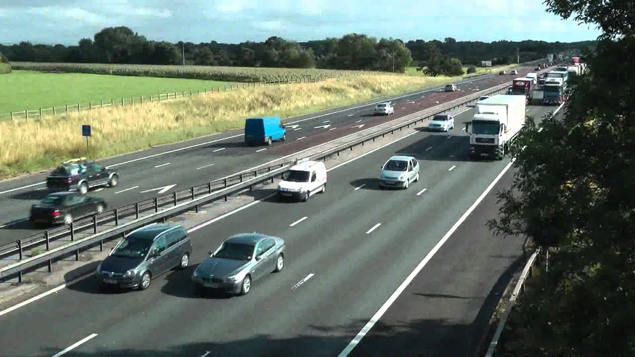 TRUCKS ON M6 MOTORWAY IN HEAVY TRAFFIC AUGUST 2011