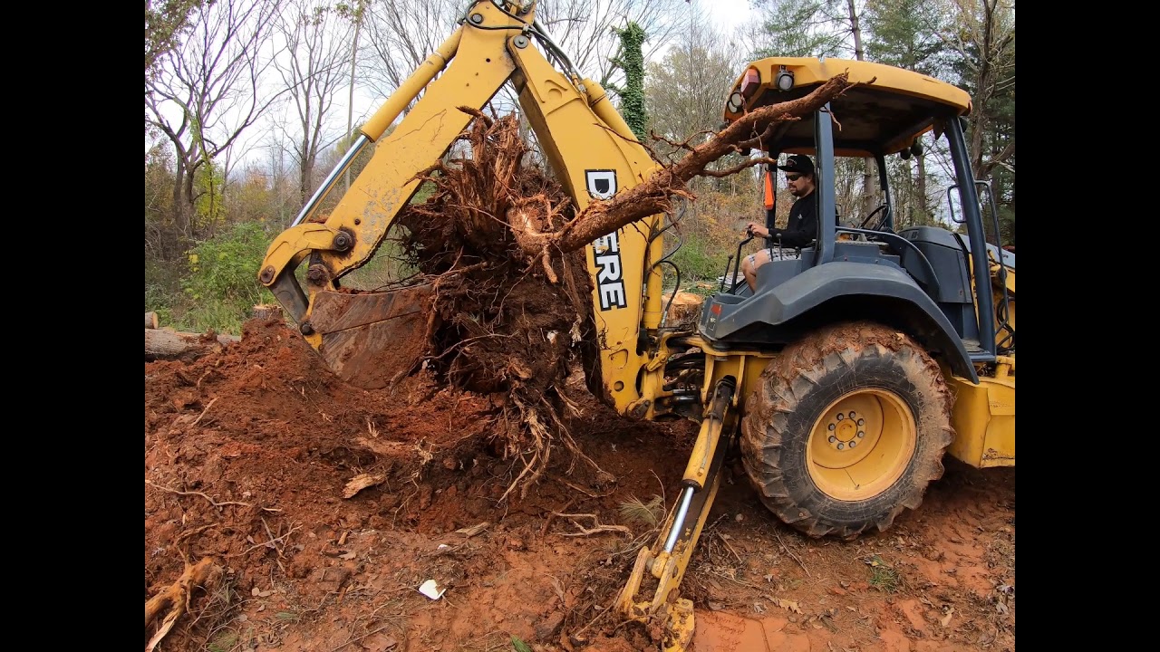 Digging Stumps with a 310SG John Deere backhoe