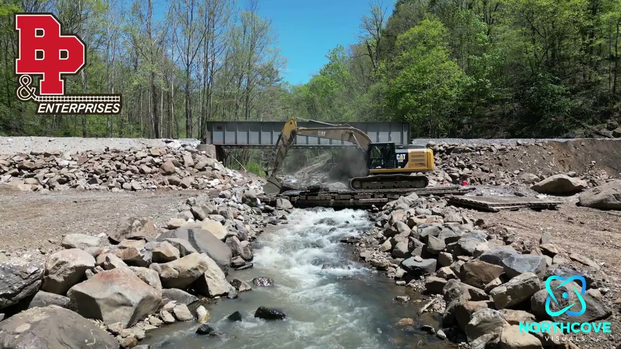 Temporary bridge being removed by B&P Enterprise excavator.