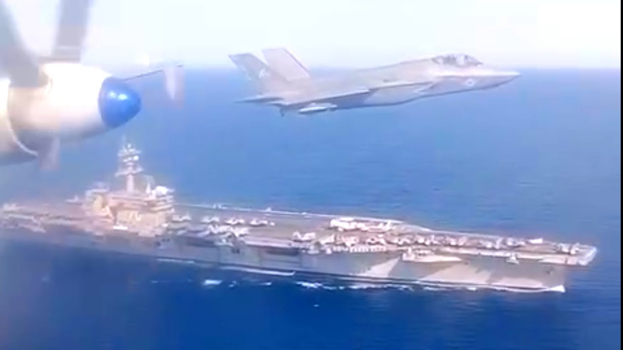 Ил-38 с F-35 пролетают над авианосцем Carl Vinson США