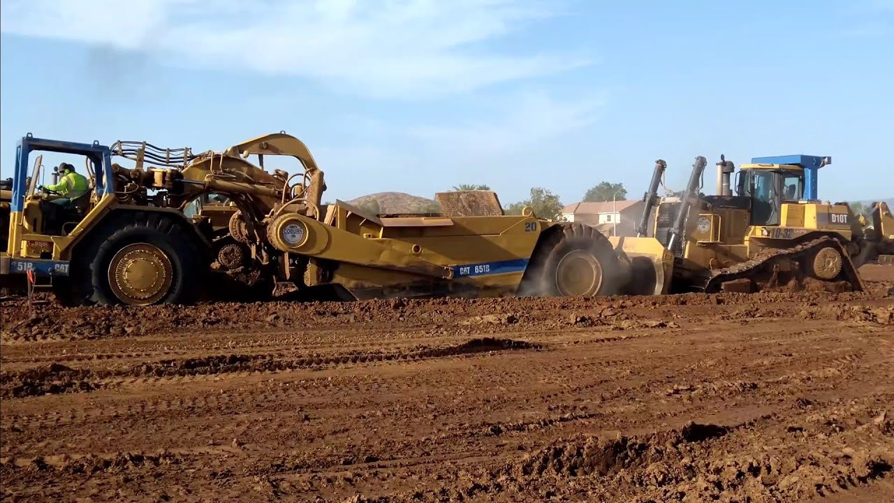 CAT D10T Dozers pushing 651B scrapers  D8T Dozer Ripping Dirt. Amazing Earthmovers