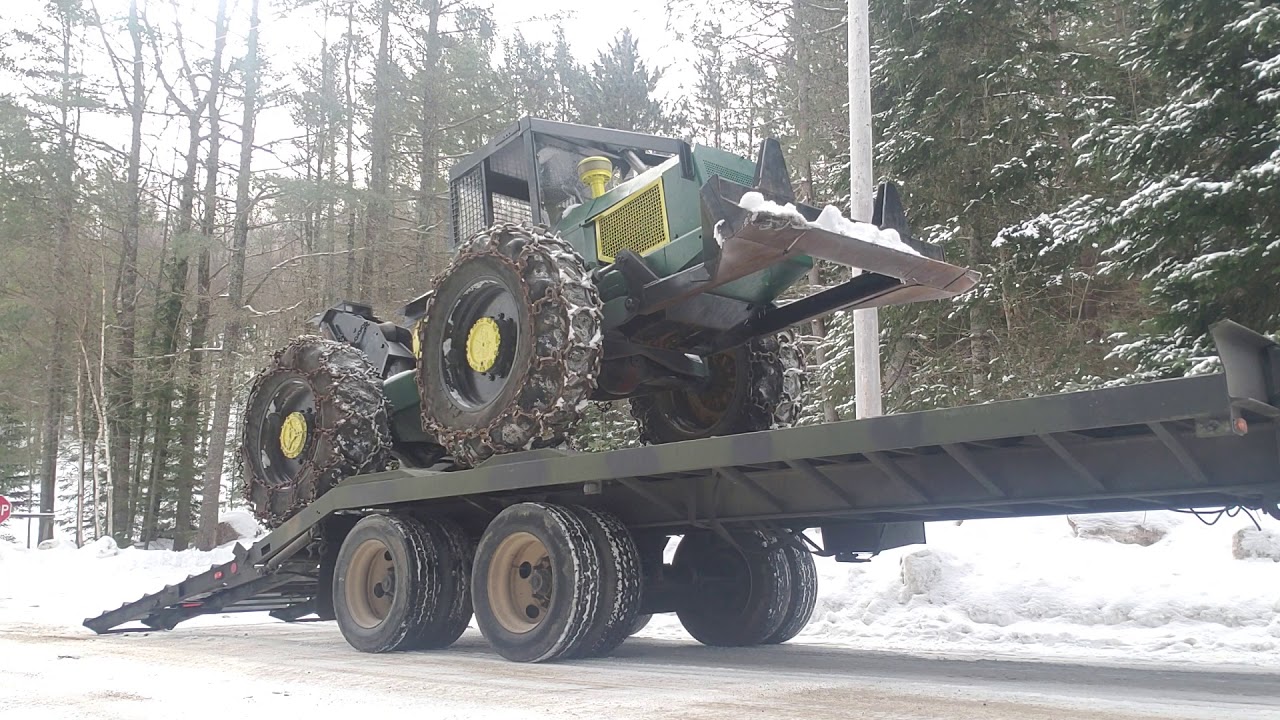 Loading the Tree Farmer C5D skidder onto the M322 trailer