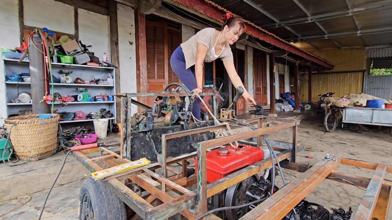 Genius girl repairs and restores cars.