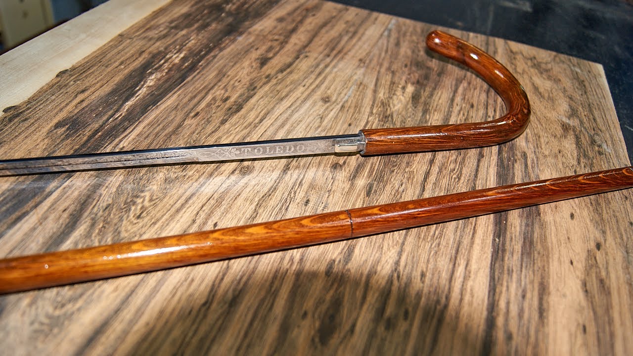 I found a secret DEADLY cane sword when i restored it. (not wood carving)