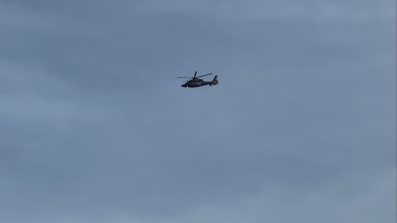 Private Eurocopter EC155 [G-HCNX] flying near the distance