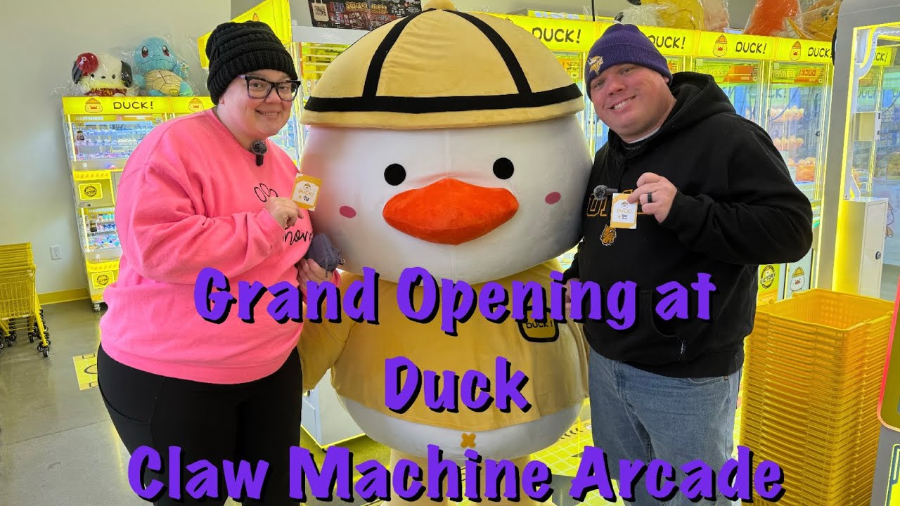 Winning plushies out of claw machines at the grand opening of Duck
