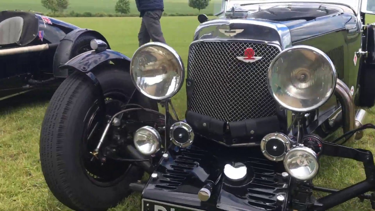 Prewar Aston Martins drive through the Cotswolds