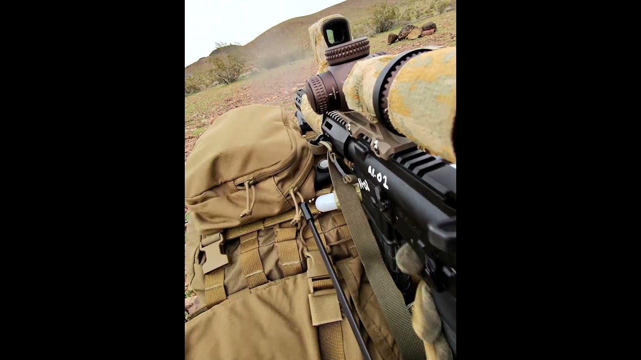 Prone. Behind the ruck. Every round deliberate.