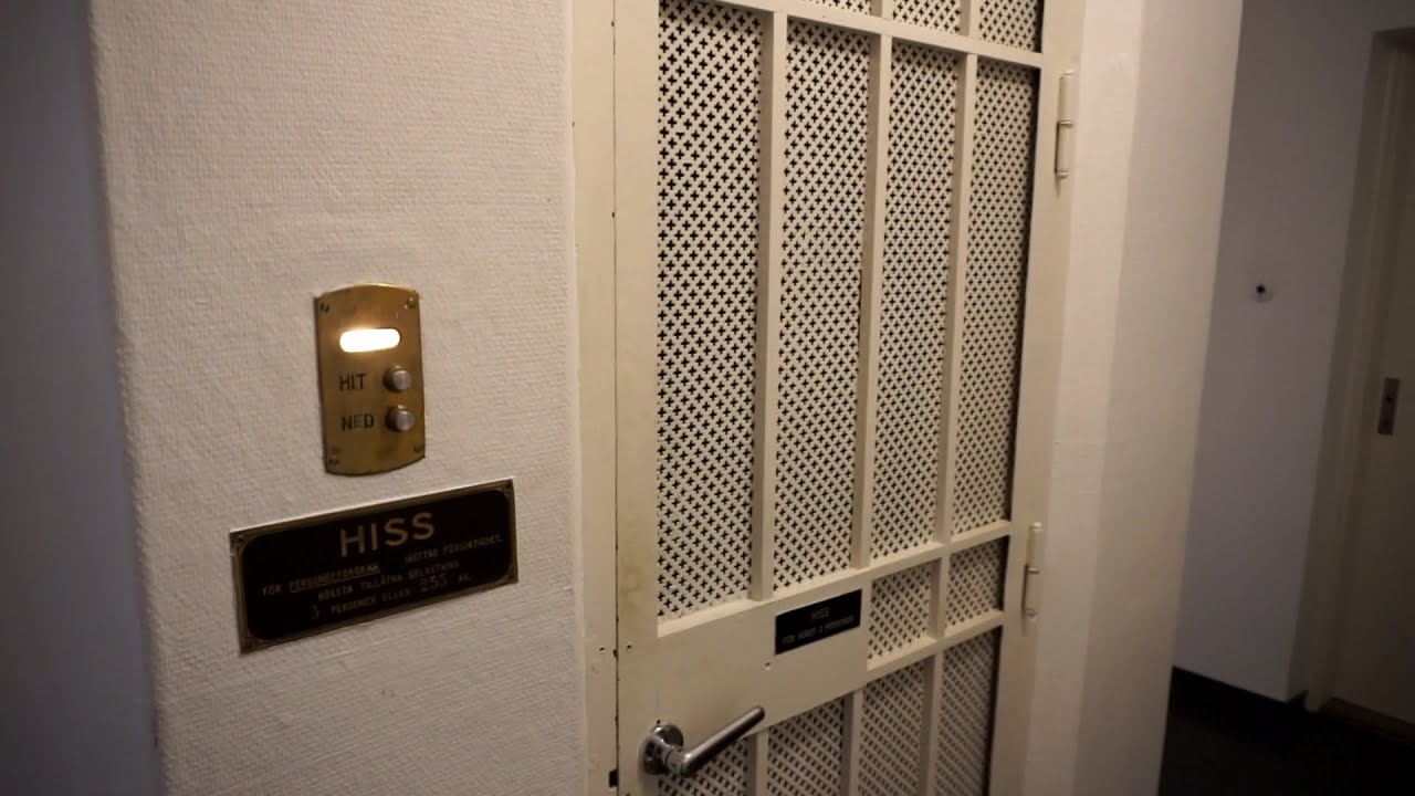 1929? gated ASEA traction elevator with hideous floor buttons @ Nygatan 55, Skellefteå, Sweden
