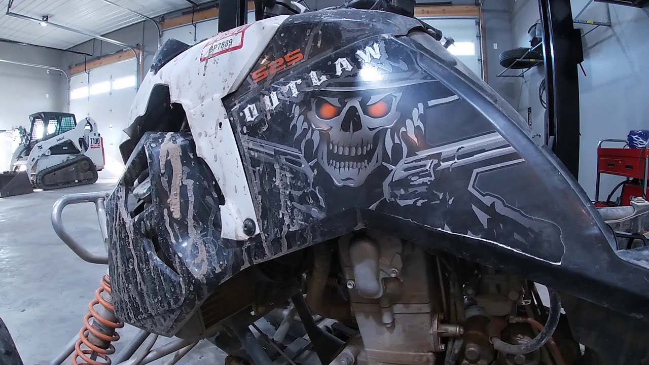 Oil change on a Polaris Outlaw 525