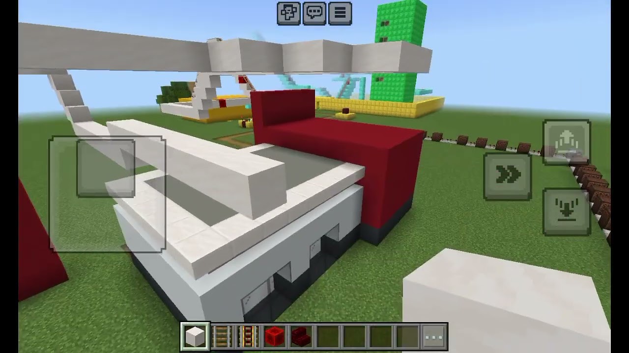 Building a rollor coaster in the backyard at my house in minecraft