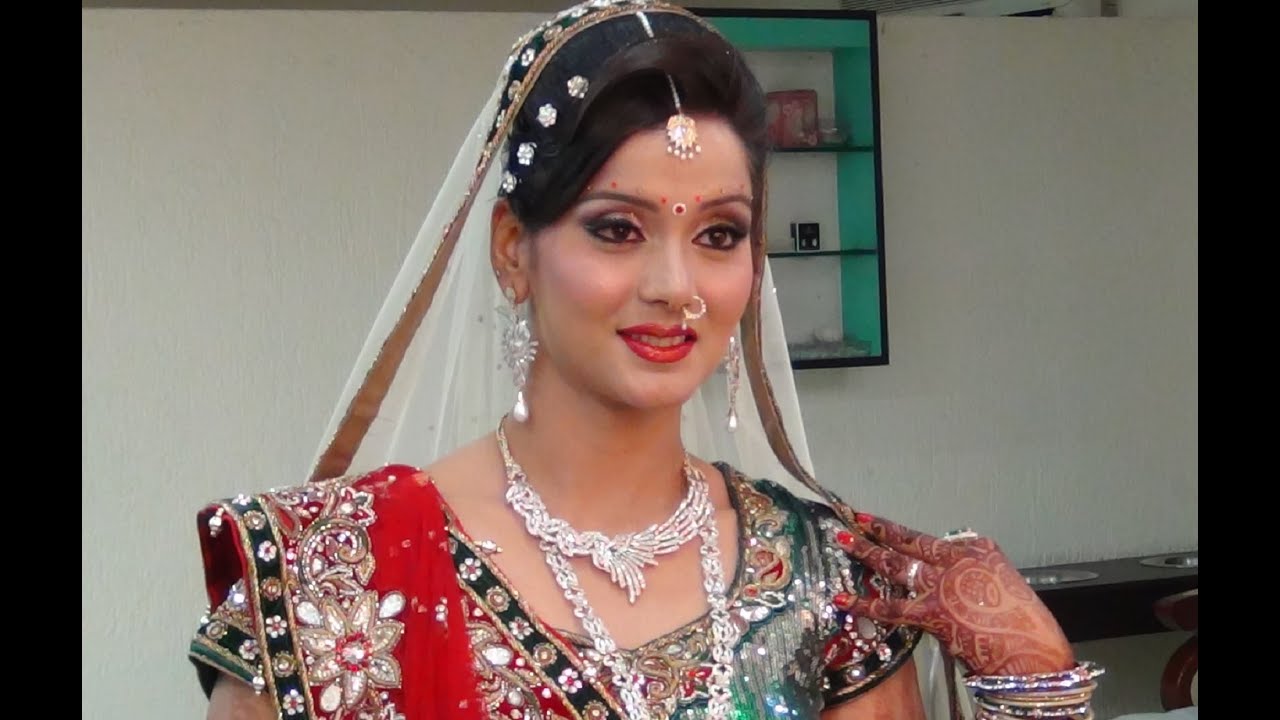Indian Bridal Makeup And Hairstyle - Off White, Gold And Green Look