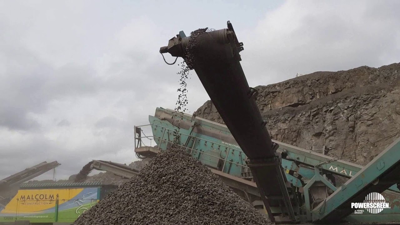 Monster Premiertrak 600 jaw crusher feeds cone & screens in basalt - Powerscreen