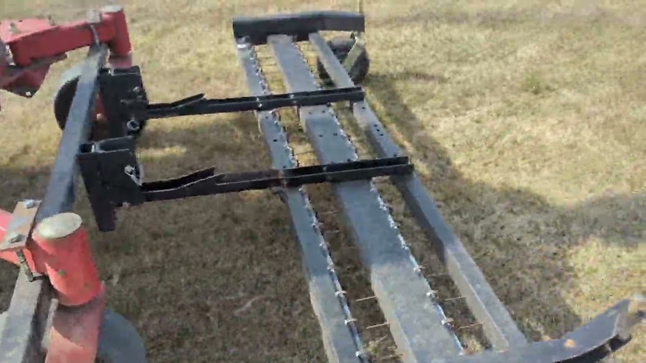 Dethatching with JRCO front mounted tine rake. Toro Grandstand