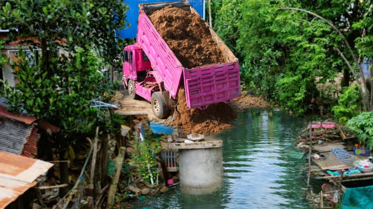 Dropping soil in the house and behind next to the big lake. Drivers passing by must be very careful.